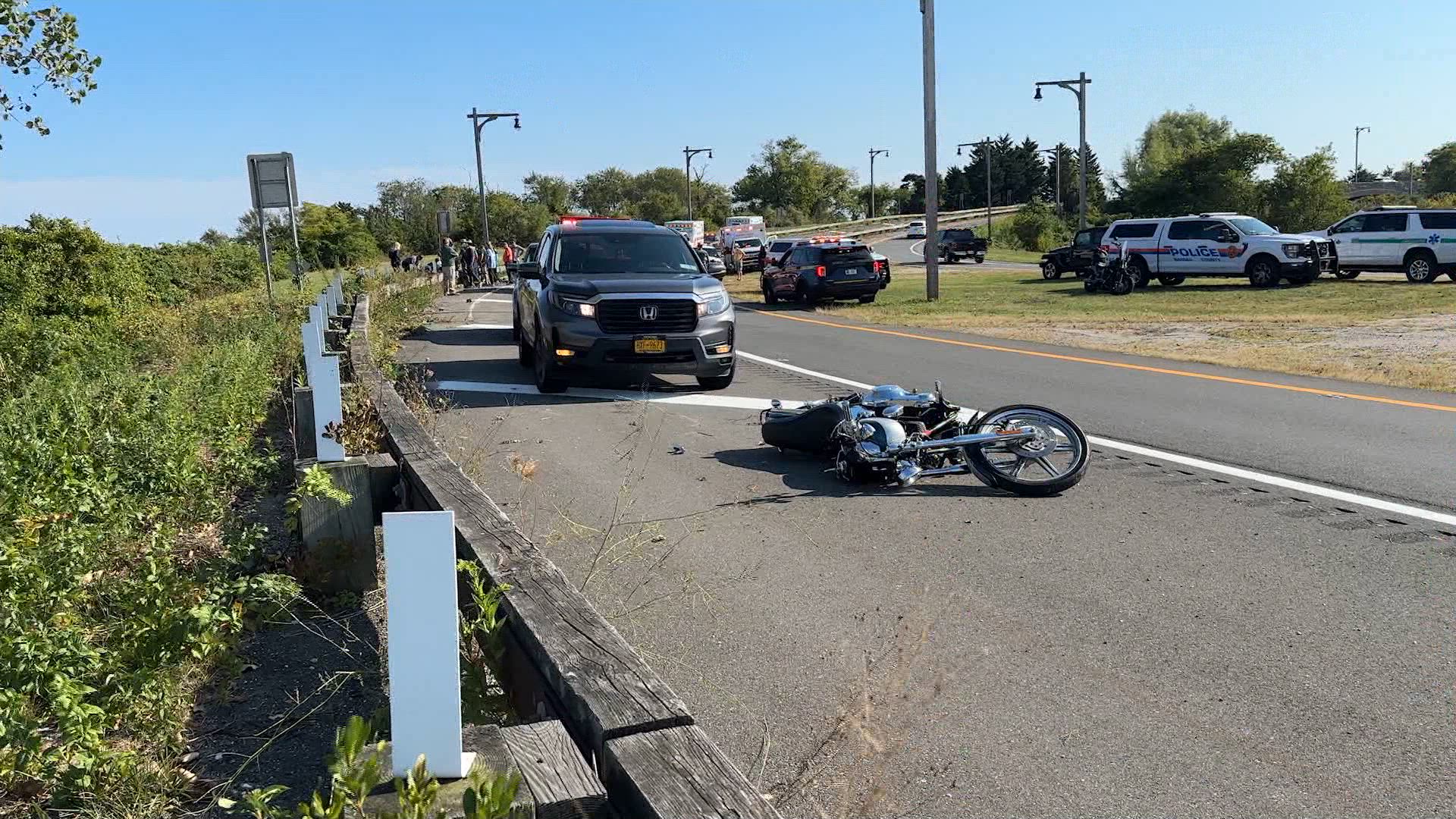 Motorcycle officer hurt in crash with truck while escorting funeral on Long Island